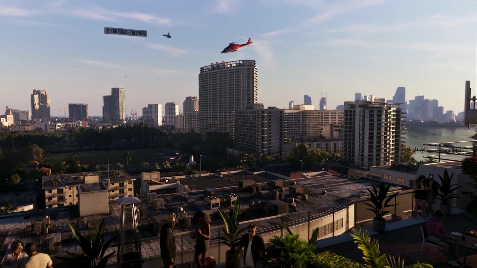 Vista aerea sulla città con due elicotteri in volo; un piccolo aereo traina uno striscione pubblicitario con una scritta satirica ('YOU FLUSH - THEY WIPE') e un'icona di rotolo di carta igienica cerchiata e sbarrata.