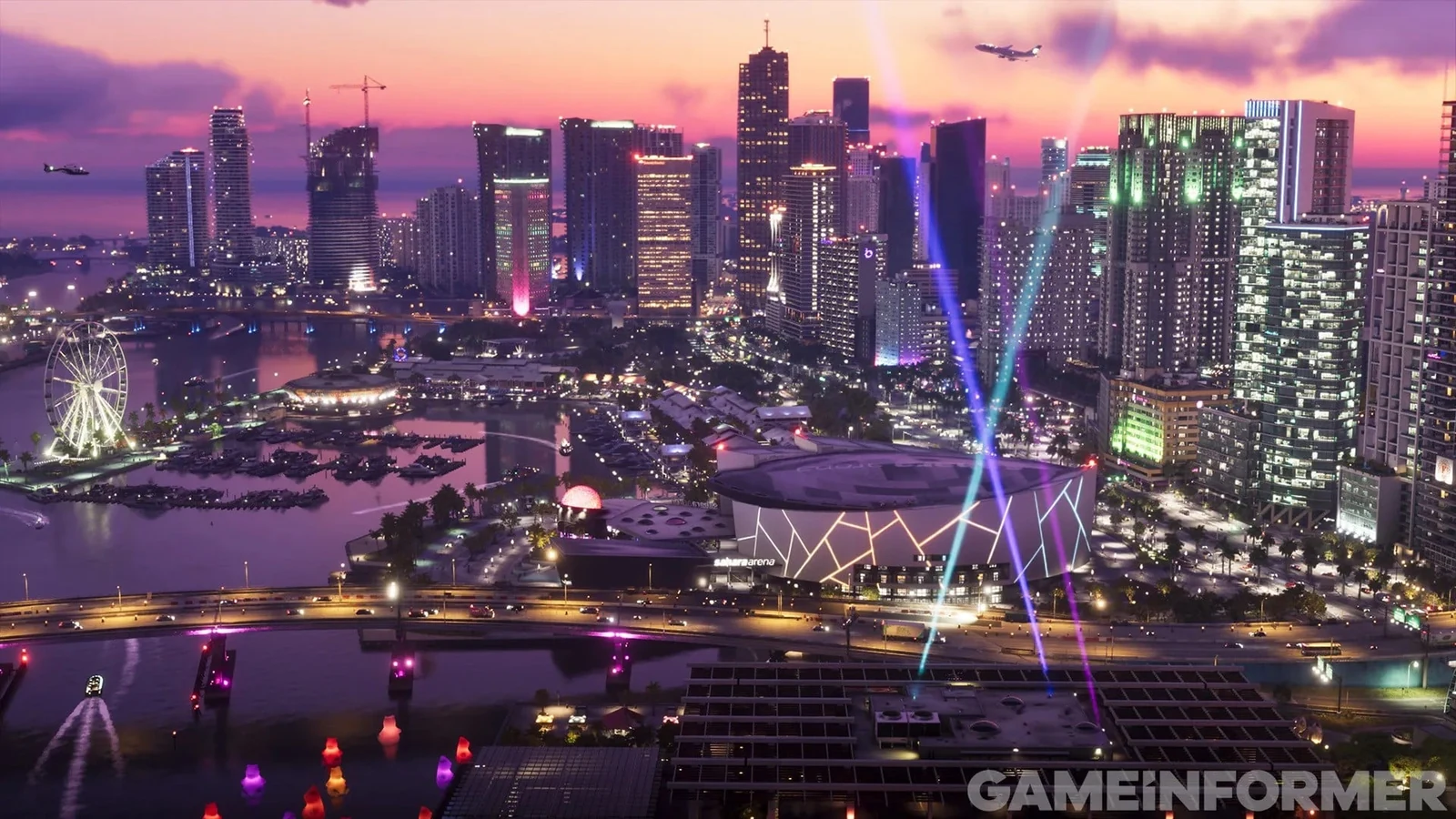 Il lungomare e i grattacieli di Vice City illuminati al tramonto.