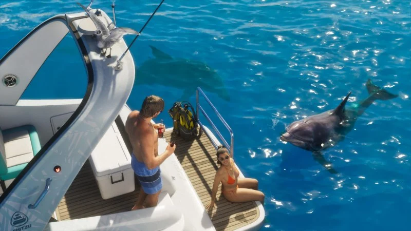 Persone a bordo di una barca accanto a un delfino.